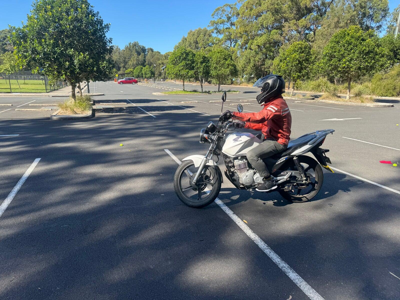 motorcycle rider training in car park